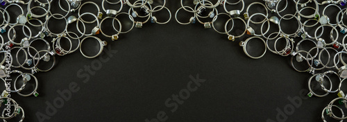 Dark gray jewelry banner. Silver rings with handmade gemstones.