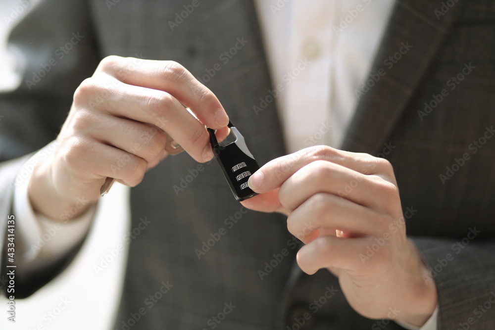 Fototapeta premium Close up of businessman holding keys