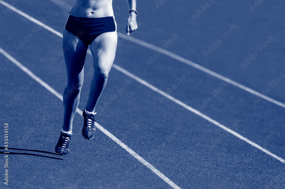 Young sporty woman running on sunny day Young sporty woman running on sunny day