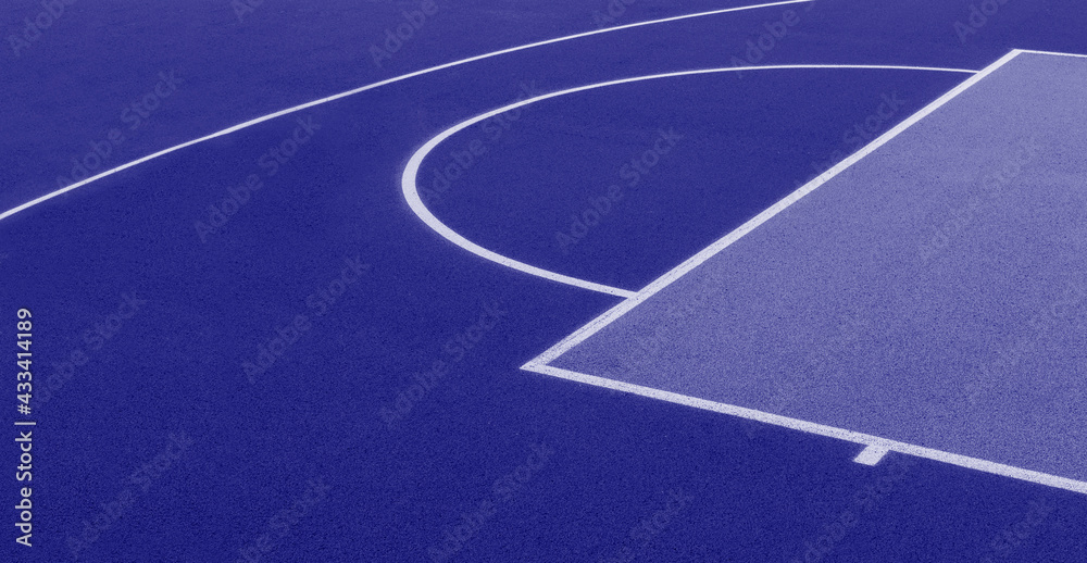 Abstract, blue background of newly made outdoor basketball court. Visible asphalt texture, freshly painted lines. Blue color filter