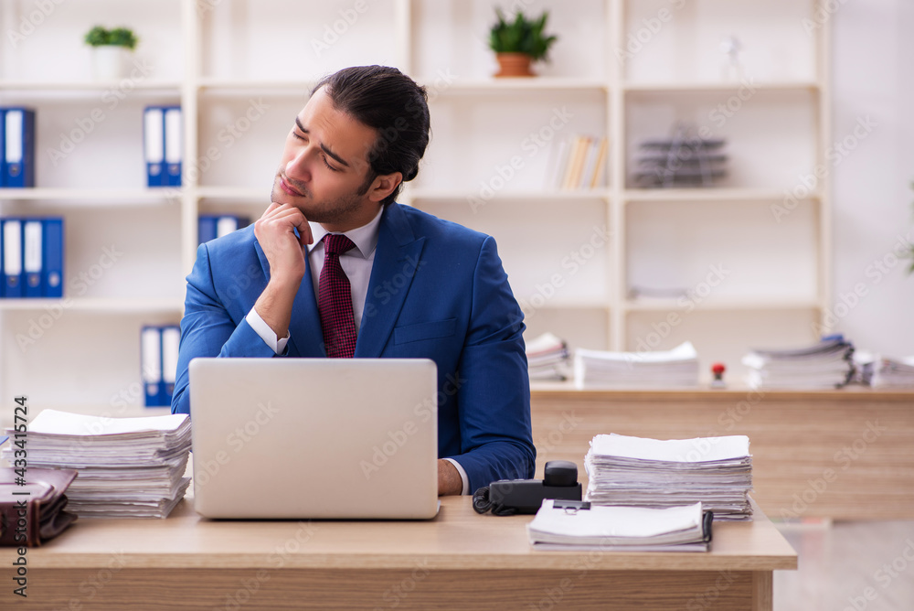 Young male employee feeling bad in the office Young male employee feeling bad in the office