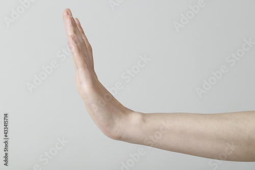 Close up of woman hand showing stop sign