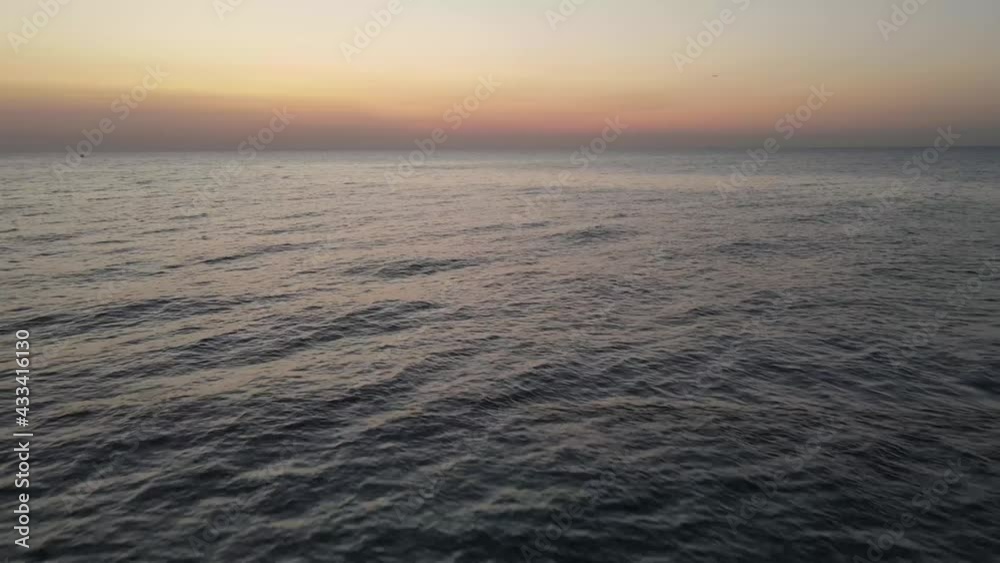 Drone flight over sea at the dusk on sunrise, Drone flight over sea at the dusk on sunrise,