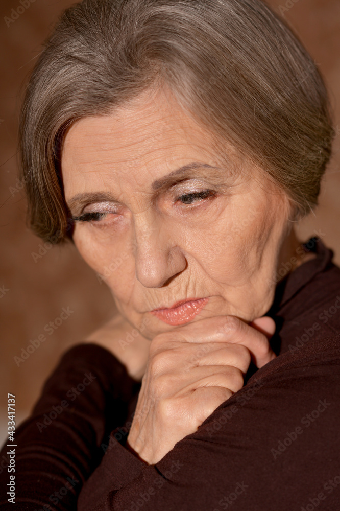 Close up portrait of sad senior woman at home Close up portrait of sad senior woman at home