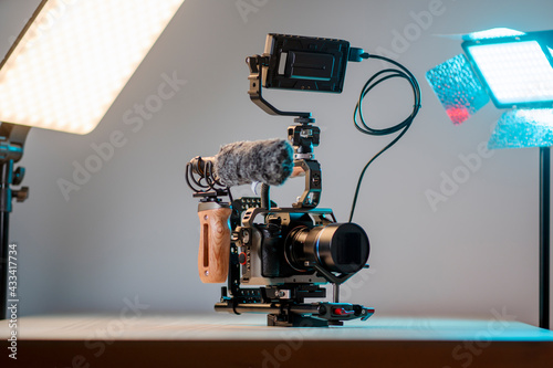 Camera with external monitor, mic, and handheld film-making rig.