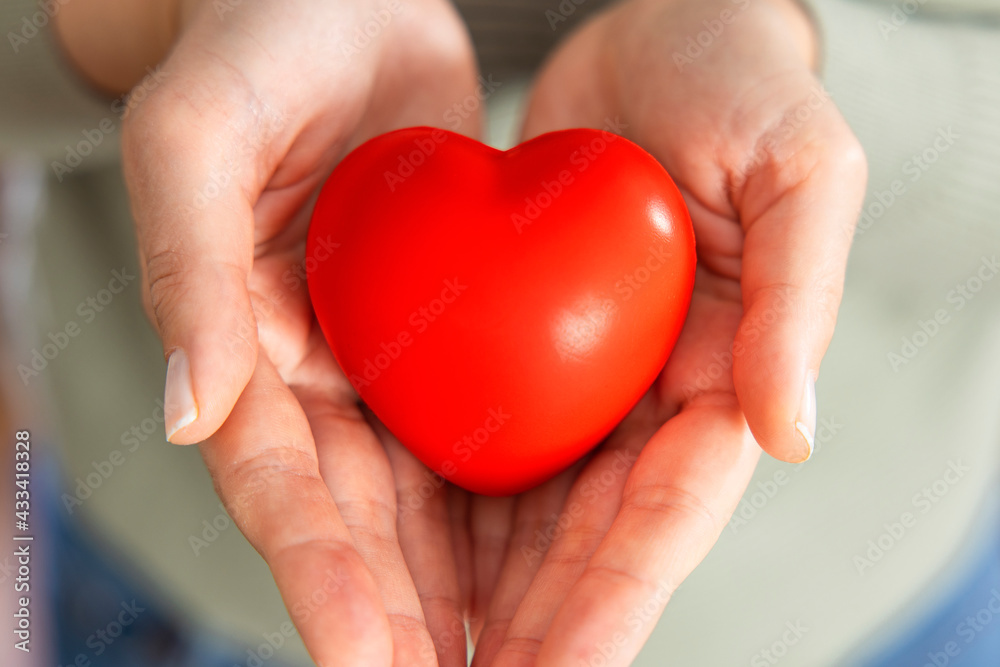 Red heart in hand Red heart in hand