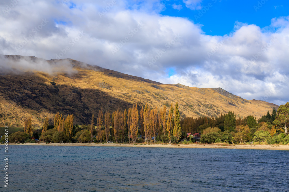 Kingston, a town on Lake Wakatipu in the South Island of New Zealand, seen from the water in autumn