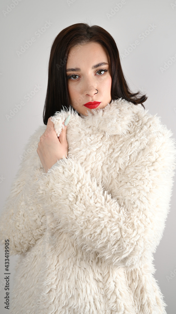 Winter fashion woman in luxurious fur coat. Beauty Fashion Model Girl. Beautiful winter girl Winter fashion woman in luxurious fur coat. Beauty Fashion Model Girl. Beautiful winter girl