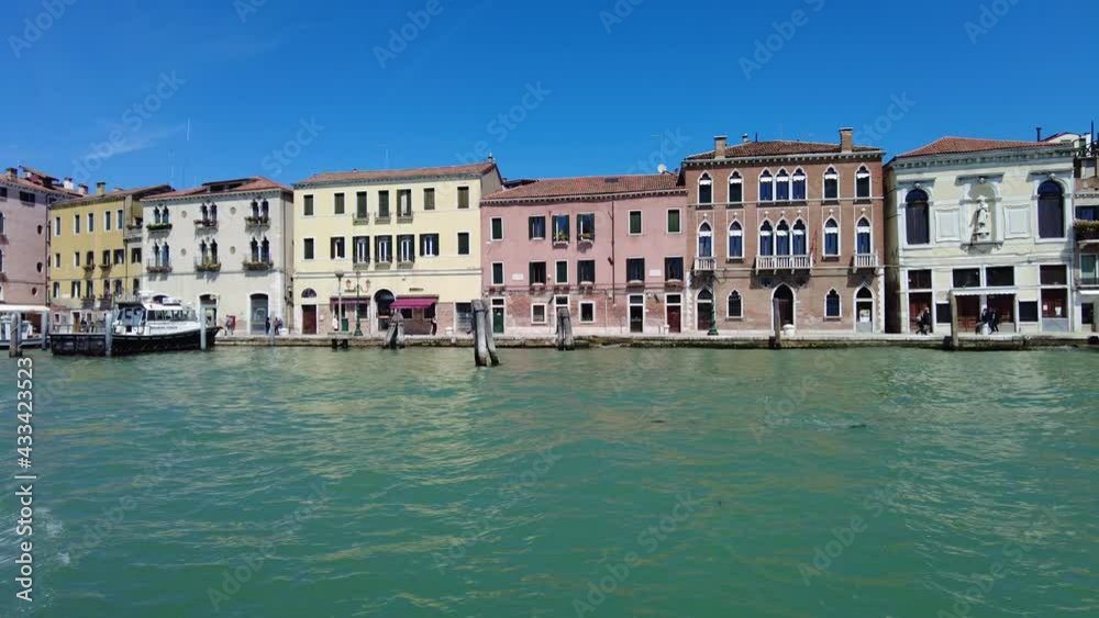 sea view by boat tour on Giudecca Canal of Venice seafront through Venetian historic buildings, by the sea in Giudecca canal of Veneto region in Italy. sea view by boat tour on Giudecca Canal of Venice seafront through Venetian historic buildings, by the sea in Giudecca canal of Veneto region in Italy.