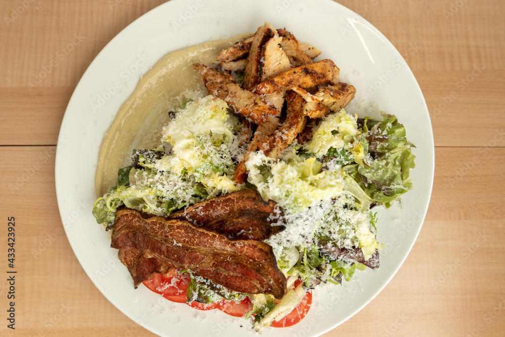 Cesar Salad from above on wooden background. Cesar Salad from above on wooden background.