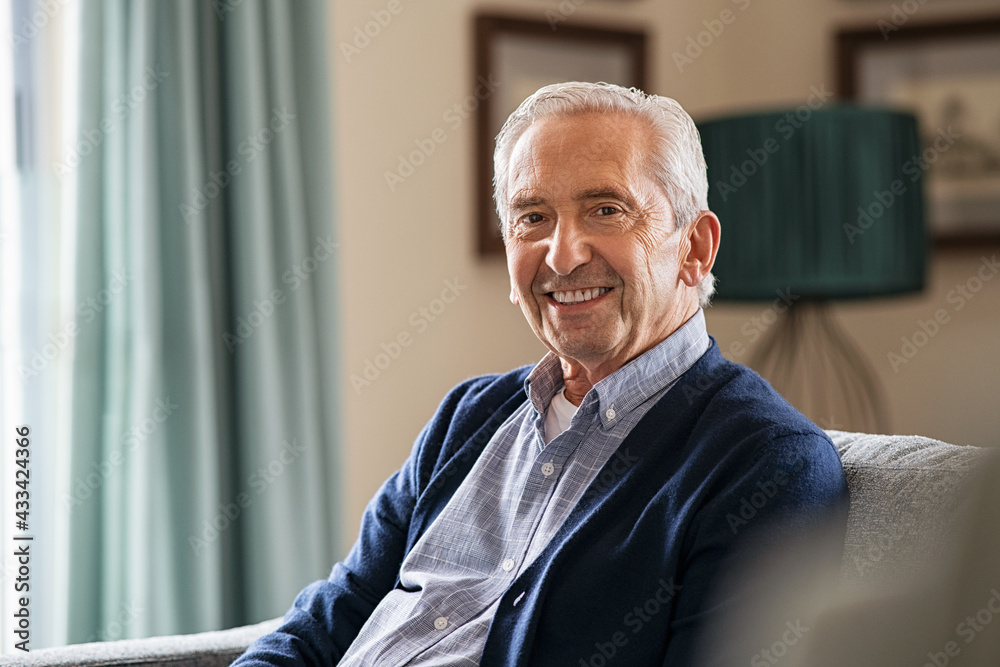 © Rido - Happy senior man sitting at home