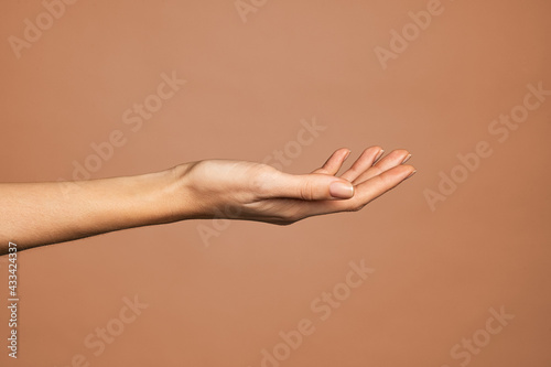 Elegant woman hand with empty palm up