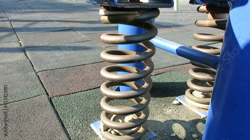 the huge wire spring of seesaw design for pressure and flexibility concept photo