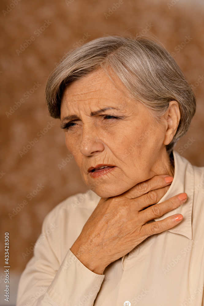 Fototapeta premium Close up portrait of sad senior woman