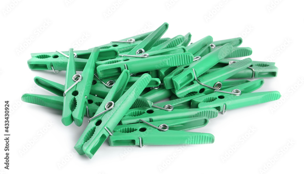 Bright green plastic clothespins on white background Bright green plastic clothespins on white background