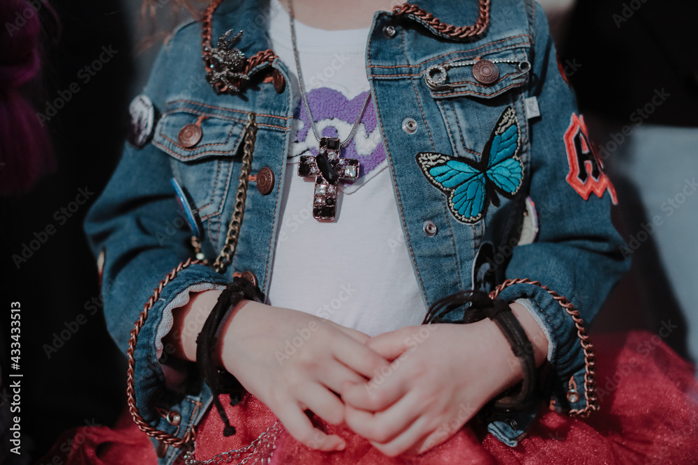Cropped child figure in denim fashion jacket