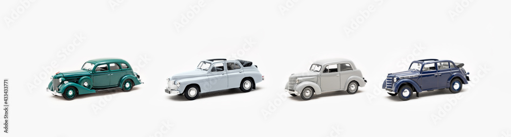 Collection of toy vintage cars on a white background isolate