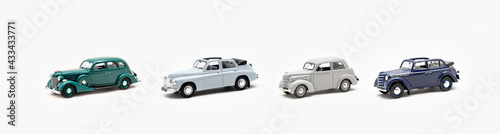 Collection of toy vintage cars on a white background isolate