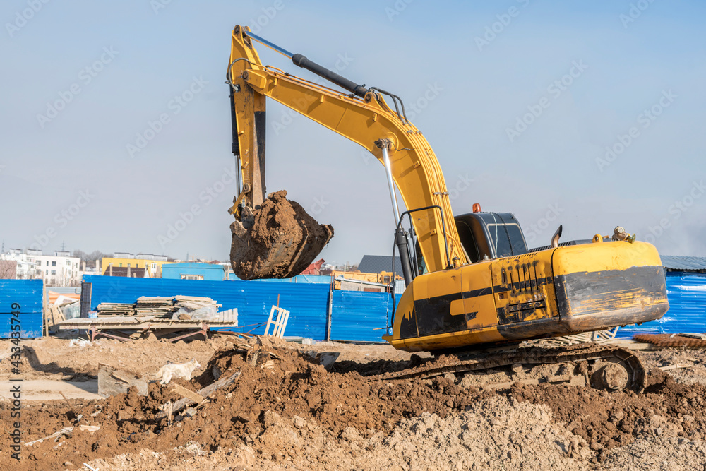 excavator bulldozer digging dirt ground, shoveling ion the construction site excavator bulldozer digging dirt ground, shoveling ion the construction site