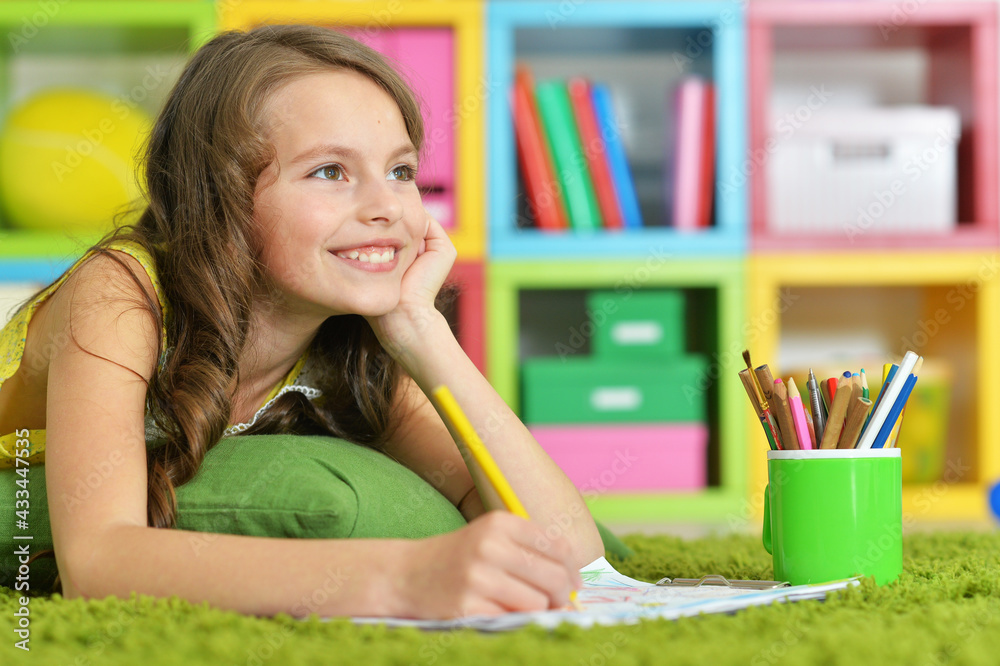 Little girl drawing in her room Little girl drawing in her room