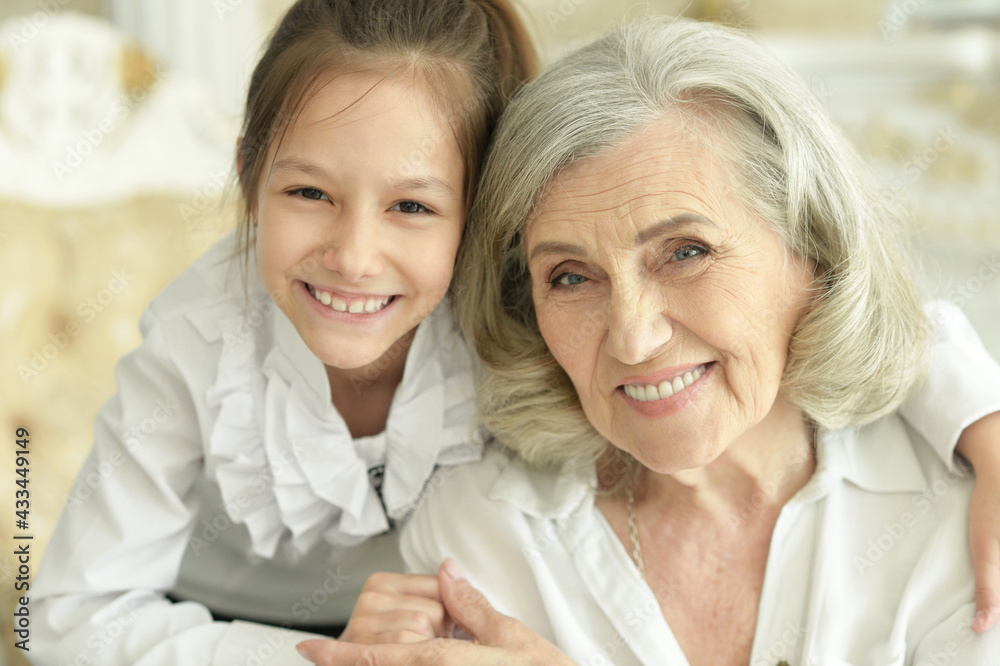 Grandmother with her cute granddaughter smiling Grandmother with her cute granddaughter smiling