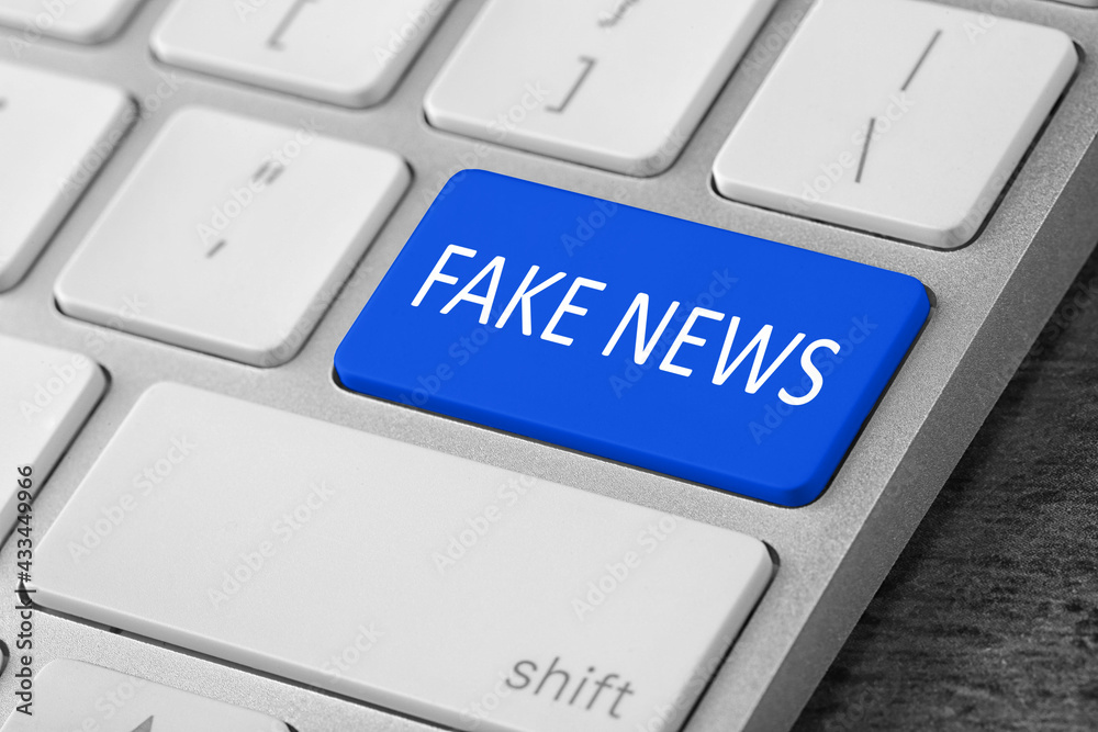 Modern computer keyboard with text FAKE NEWS on button, closeup Modern computer keyboard with text FAKE NEWS on button, closeup