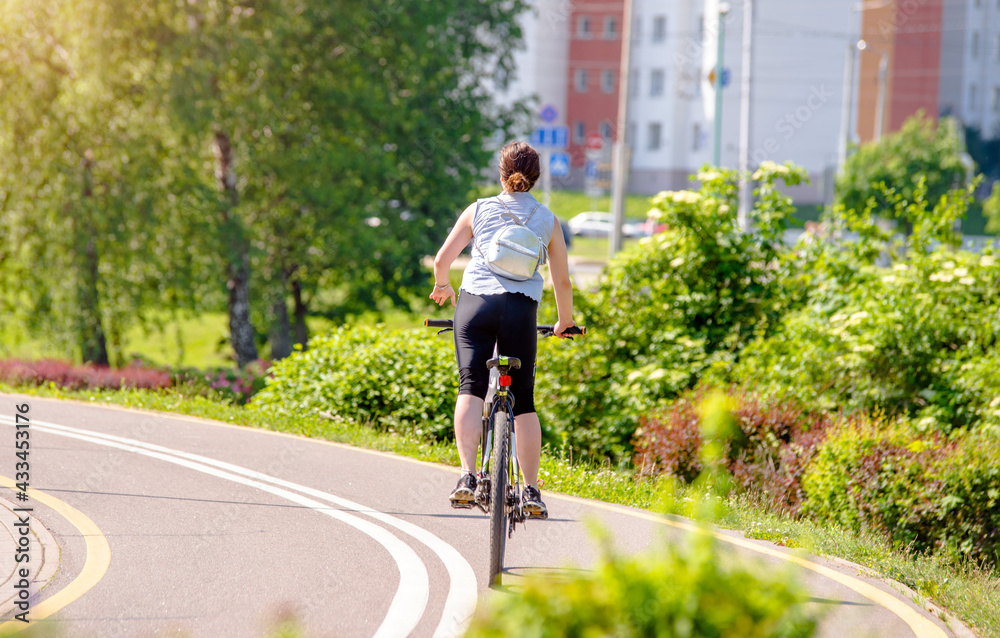 Cyclist ride on the bike path in the city Park
