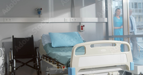 Empty bed and wheelchair n modern hospital room © TommyStockProject