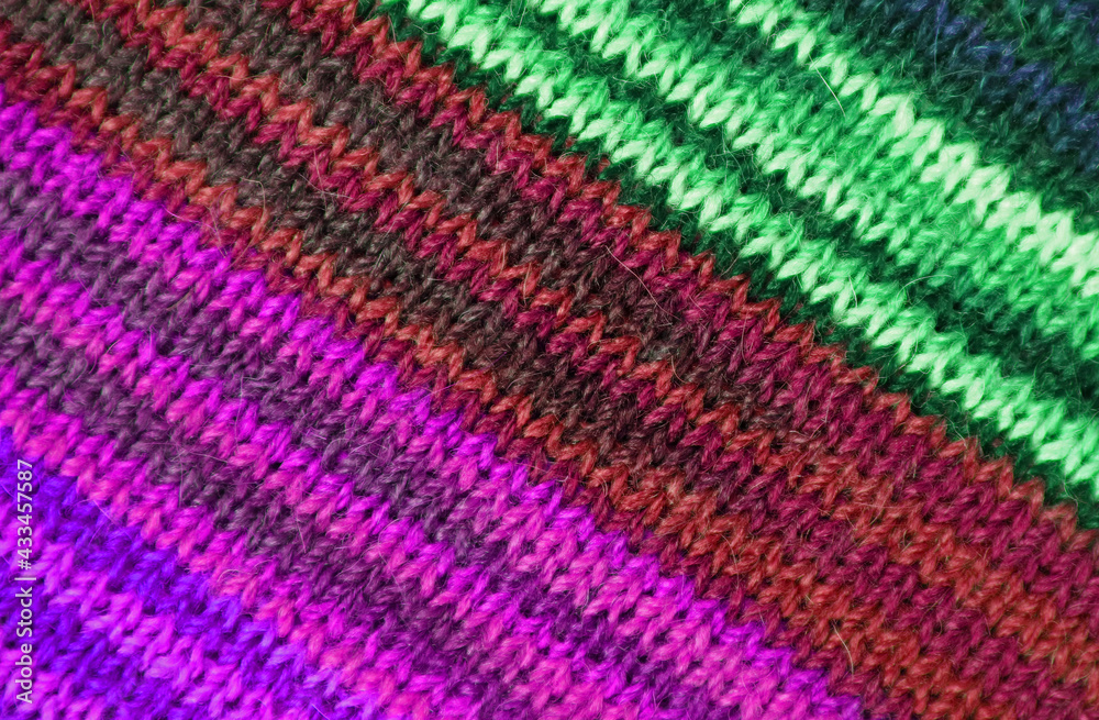 Green and Purple Tone Striped Alpaca Knitted Wool Fabric Texture in Diagonal Patterns for Abstract Background