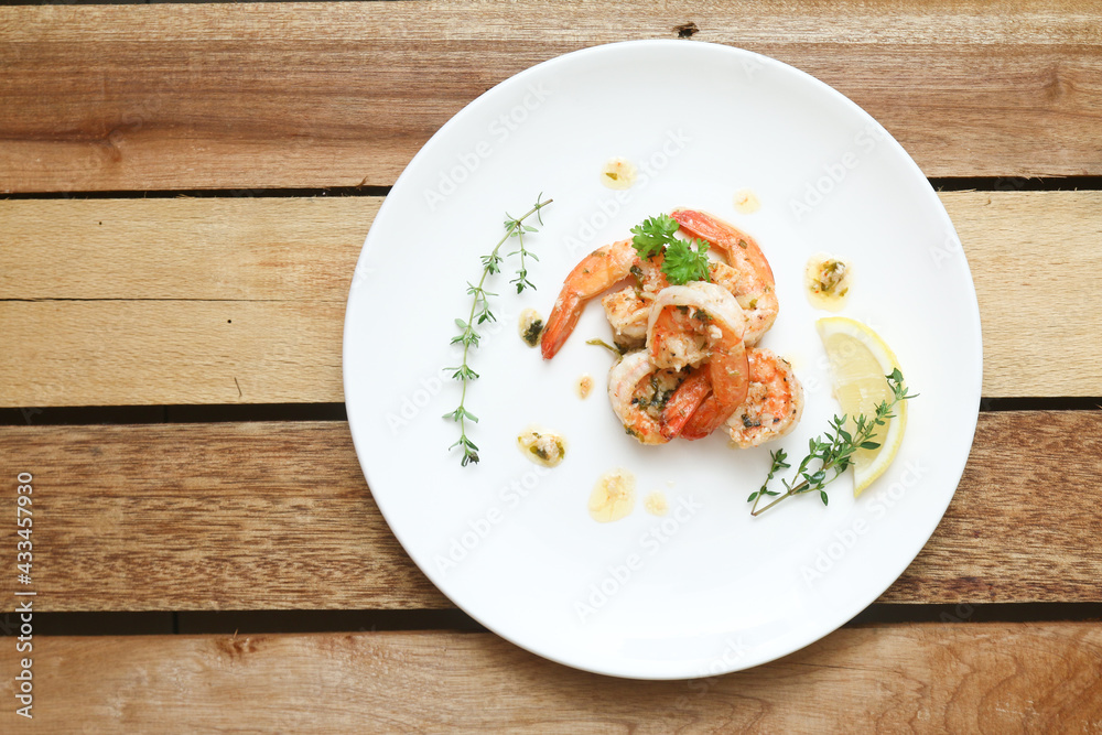 Lemon butter herb shrimps on plate