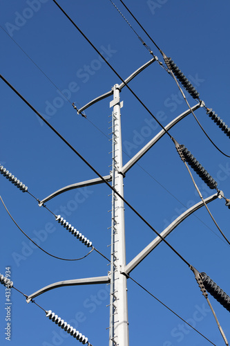 Electrical Power Lines tower against a blue sky