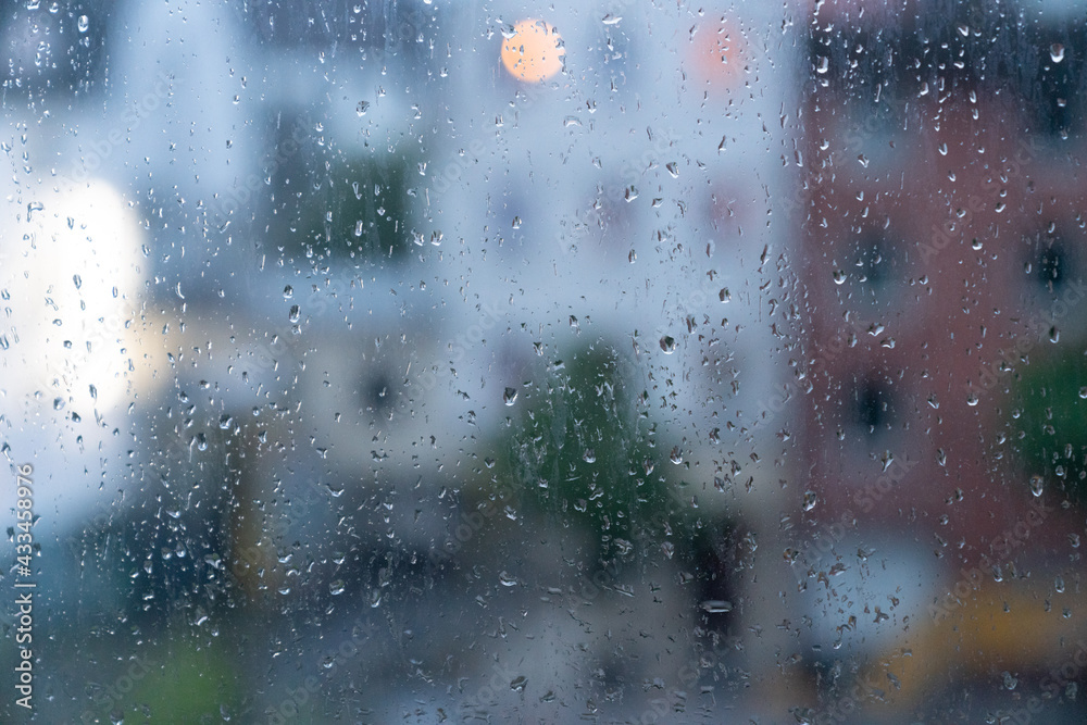 View of the city in rainy weather through the glass View of the city in rainy weather through the glass