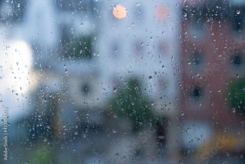 View of the city in rainy weather through the glass © luchschenF
