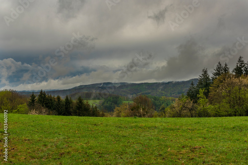 Meadows and forests near Vizovice town after big rain with cloudy sky