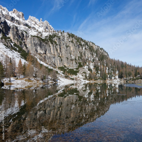 lake reflection mountain steep snow