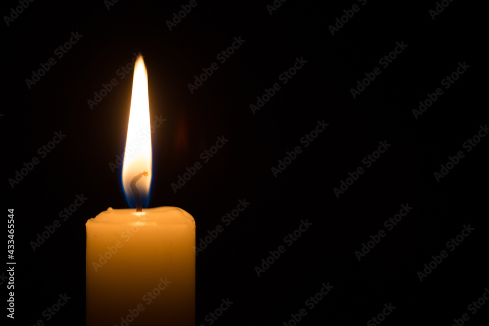 candle burning on black background. concept of faith, memory, prayer, commemoration candle burning on black background. concept of faith, memory, prayer, commemoration