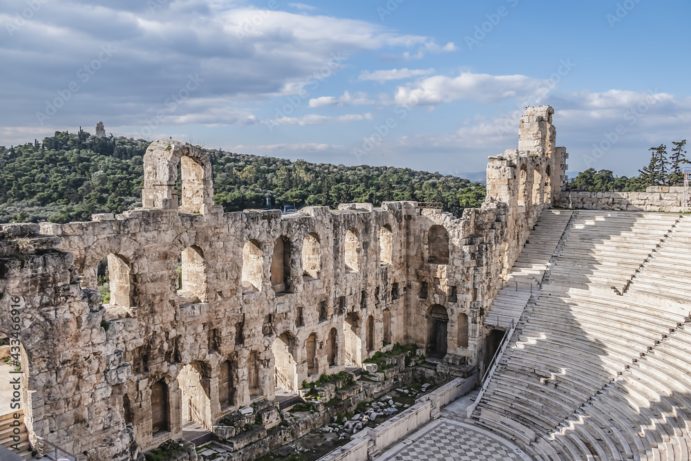 Top view of Greek ruins of Odeon of Herodes Atticus (161AD) - stone Roman theater at the Acropolis hill. Athens, Greece.