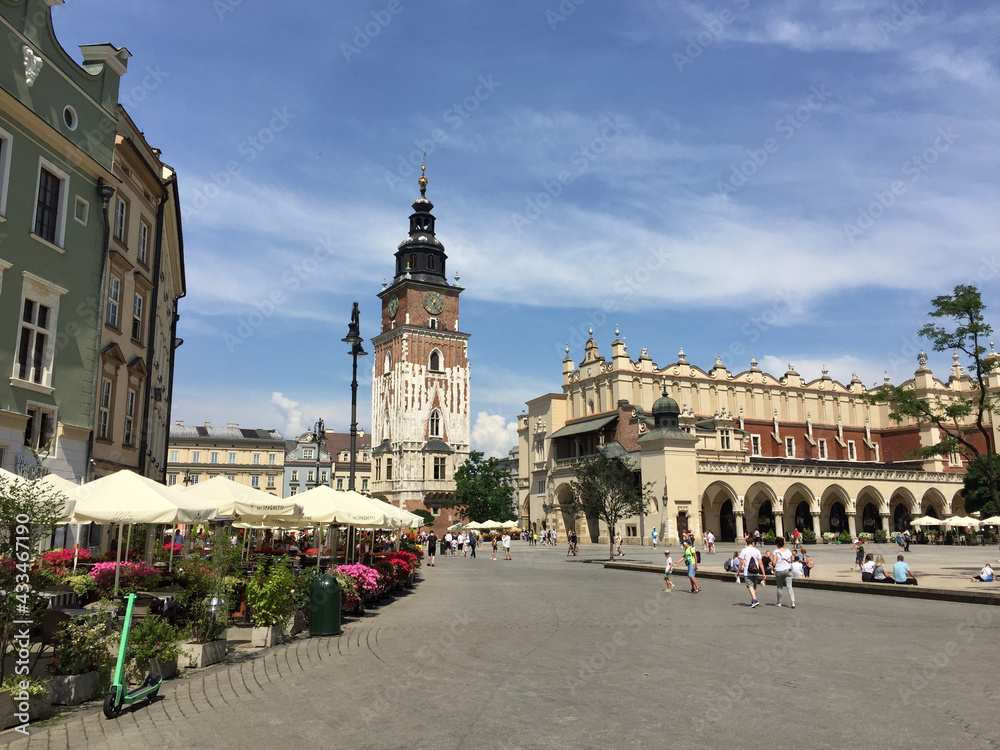The Cloth Hall and the Town Hall Tower in Krakow's Main Square (Polish: Rynek Główny). Dating back to the 13th century, and at 3.79 ha (9.4 acres) is the largest medieval town square in Europe. - obrazy, fototapety, plakaty 