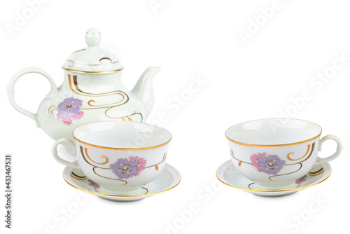Ceramic teapot and two tea cups isolated on white background. Free space for text.
