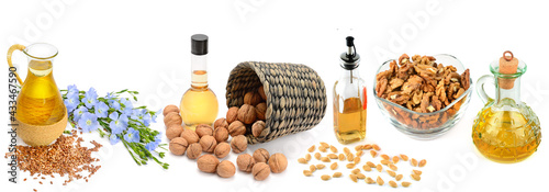 Photos oils from walnut, flax seeds and pumpkin seeds isolated on white background