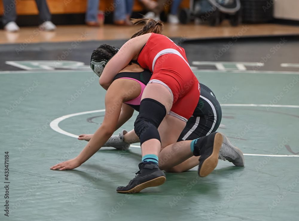 Female High School wrestlers competing at a wrestling meet StockFoto
