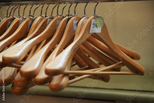 Deserted cloakroom clothes rack in convention center photo
