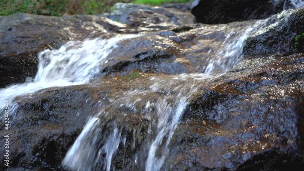 Small waterfall in the forest with the water falling between the rocks. Navacerrada Madrid. Small waterfall in the forest with the water falling between the rocks. Navacerrada Madrid.