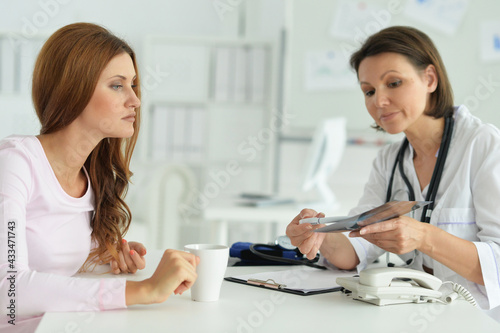  woman in hospital with caring doctor