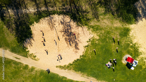 View from the height of the beach and people playing volleyball in Drozdy in Minsk.Belarus photo