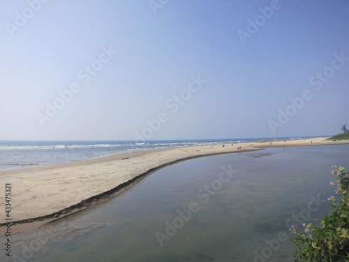 Goa beach  blue cloudless sky  water.