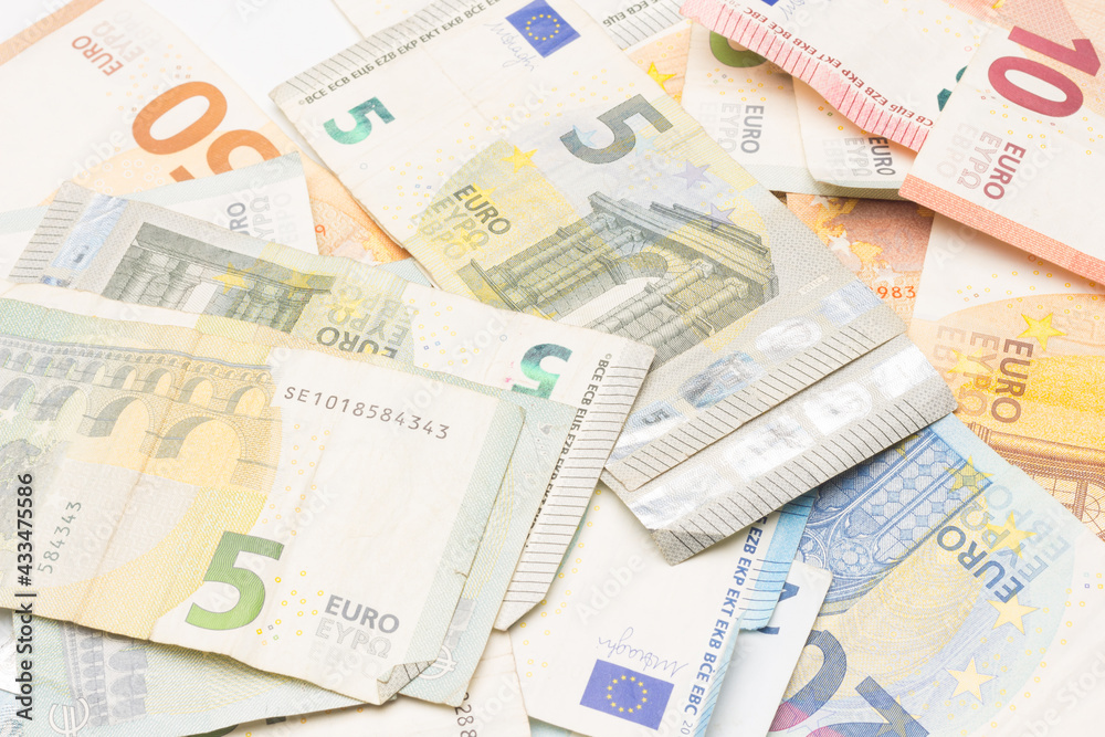 Money in coins and Euro banknotes, official currency of Europe Money in coins and Euro banknotes, official currency of Europe