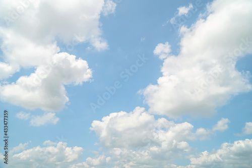Bright blue sky with fluffy white clouds  The idea for the feeling of fresh weather  Bright blue sky with fluffy white clouds  Clean on a hot sammer day. Fresh blue sky and soft white clouds.