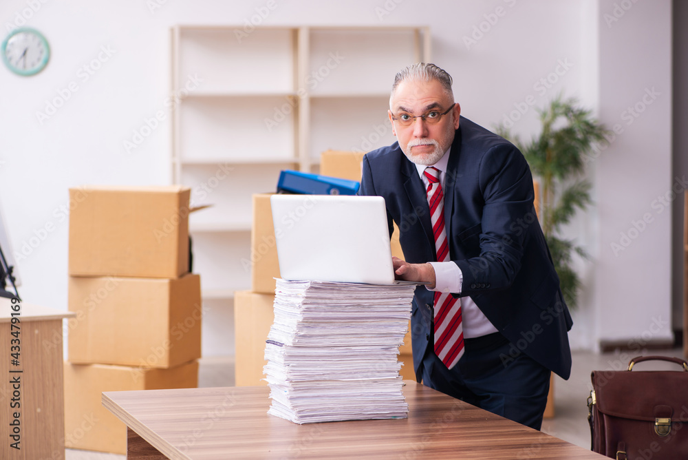 Old businessman employee in relocation concept Old businessman employee in relocation concept