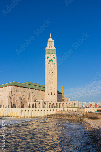 Hassan II mosque in Casablanca, Morocco against blue sky background. Islamic culture. 